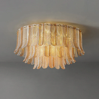 Plafonnier en verre Plume, hauteur réglable, longue suspension ronde en fer doré