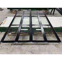Fournisseur de portes de garage en aluminium blanc de 16 pieds de large et 8 pieds de haut avec cadre en alliage d'aluminium et verre isolant transparent ou givré