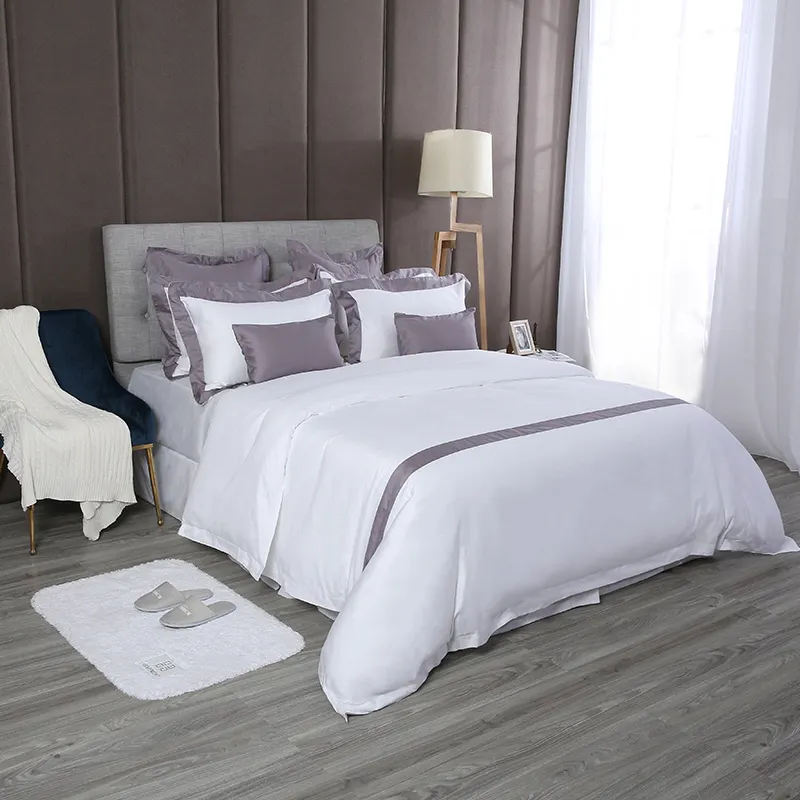 La biancheria da letto bianca dell'hotel della candeggina della biancheria da letto della banda del lenzuolo dell'hotel di lusso a 5 stelle del cotone organico 100% mette guangzhou