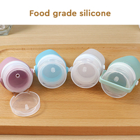 Lot de 4 flacons cosmétiques de recharge de 2oz en silicone pour articles de toilette.