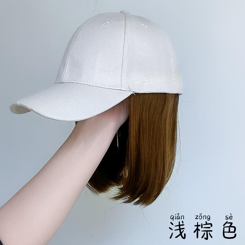 Beige hat, collarbone-length hair - light brown