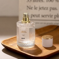 Flacon de parfum en verre de haute qualité de 50 ml, fond épais, cylindrique, vertical, avec bouchon à vis, pulvérisateur, sérigraphie