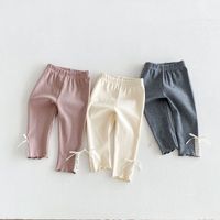 Pantalon bébé fille en coton uni à taille élastique avec nœud et dentelle pour le printemps et l'automne