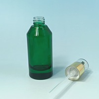 Crème pour le visage verte 50 ml et huile essentielle en flacon en verre avec pulvérisateur à pompe, diffuseur de parfum rond transparent