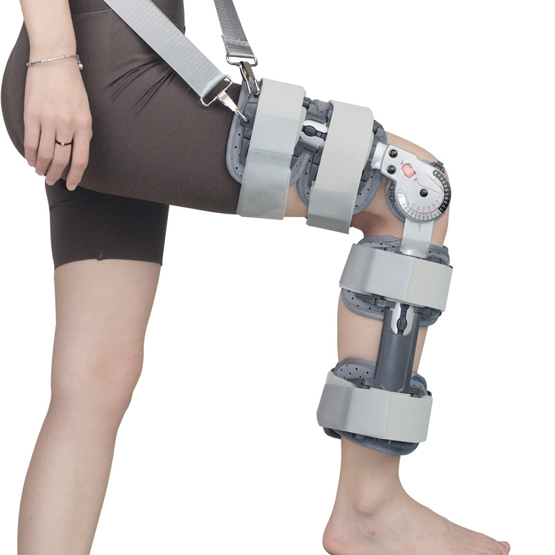 Knee brace with shoulder strap