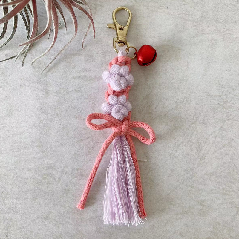 Artiglio di gatto viola-fiocco rosa