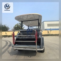 Voiturette de golf électrique noire et champagne au style vintage pour le transport dans les complexes hôteliers et l'hôtellerie