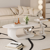 Table basse Voyage style crème, plateau ovale minimaliste en pierre pour salon, table à thé créative dorée avec boule