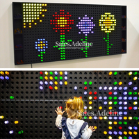 Jeux muraux interactifs LED Sensory Wall Bright Lite Led Pegboard pour jeu d'enfants