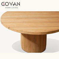 Table de salle à manger ronde en teck artisanal pour extérieur, résistante aux UV et imperméable, idéale pour hôtel et terrasse en plein air