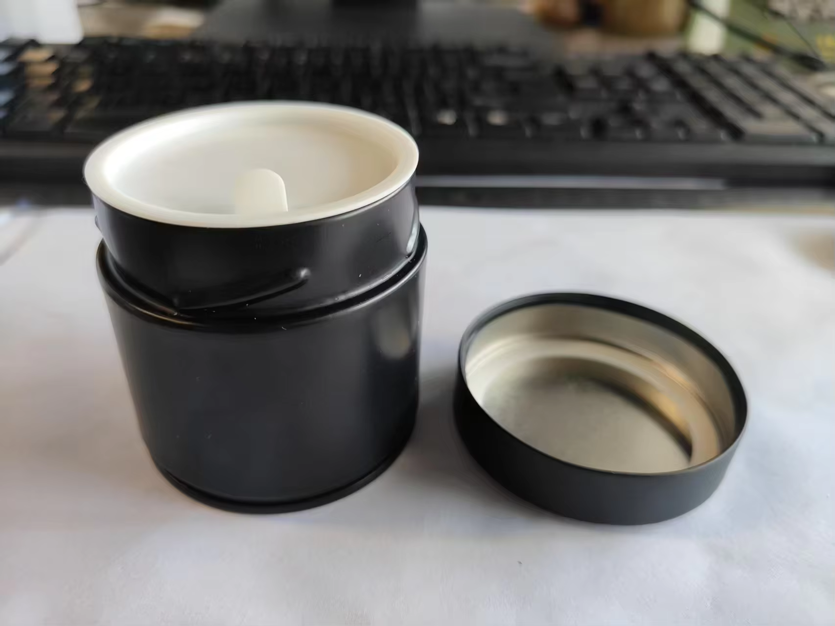black with inner plastic lid
