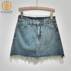 H1375C 2024 Frühjahr Denim-Rock für Damen Diamanten Knopf Taschen Plüsch Hem hohe Taille Wickeln Hüft Röcke weibliche Neue Artikel