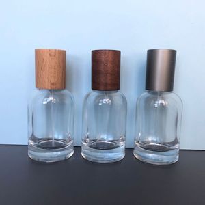 Botella de Perfume Premium de 30 ml, Botella de Vidrio Redonda con Pulverizador, Tapa de Madera y Metal, Dispensador de Cosméticos Portátil, Envase de Fragancia de Alta Gama - Product Image 1
