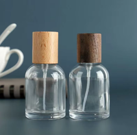 Vente en gros de flacons de parfum ronds en verre transparent de 15 ml, 30 ml, 50 ml, flacon vide pour cosmétiques et parfums avec bouchon pompe et boîte cadeau