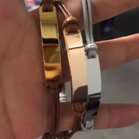 Bracelet en paracorde en acier inoxydable poli à prix d'usine avec accessoires en anneaux métalliques personnalisés