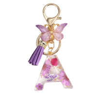 Porte-clés en résine et alliage léger, réutilisable, à la mode, avec fleurs séchées papillon et marguerite faites à la main, pour femmes, vente en gros