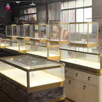Vitrine de présentation de bijoux de luxe Sundo, comptoir de magasin de bijouterie, armoire en verre, îlot, piédestal, finition dorée, fabricant pour la vente au détail