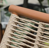 Fauteuil à bascule moderne en corde tressée avec coussin en velours et structure en acier carbone, chaise de relaxation