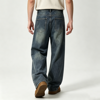 Jean bleu délavé pour homme, coupe ample et large, style ballon, avec coutures apparentes, effet usé, passe-ceintures, streetwear, délavage intense