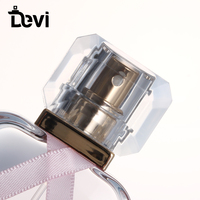 Ligne de production complète Devi, flacons de parfum en verre de 30 ml, estampage à chaud, vaporisateur à pompe, personnalisable, nœud rose, style luxueux, boîte en carton