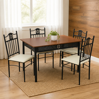 Table à manger rectangulaire avec 4 chaises rembourrées, cadre en métal noir ajouré et sculpté pour cuisine et salle à manger
