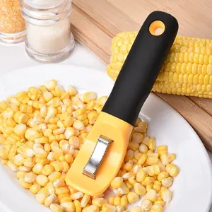 Nuevo estilo de utensilios de cocina de plástico de maíz stripper pelador con un toque de manejar