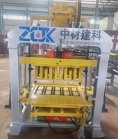 Machine à fabriquer des blocs interverrouillés et creux QTJ4-40 avec PLC et pompe pour briques en ciment