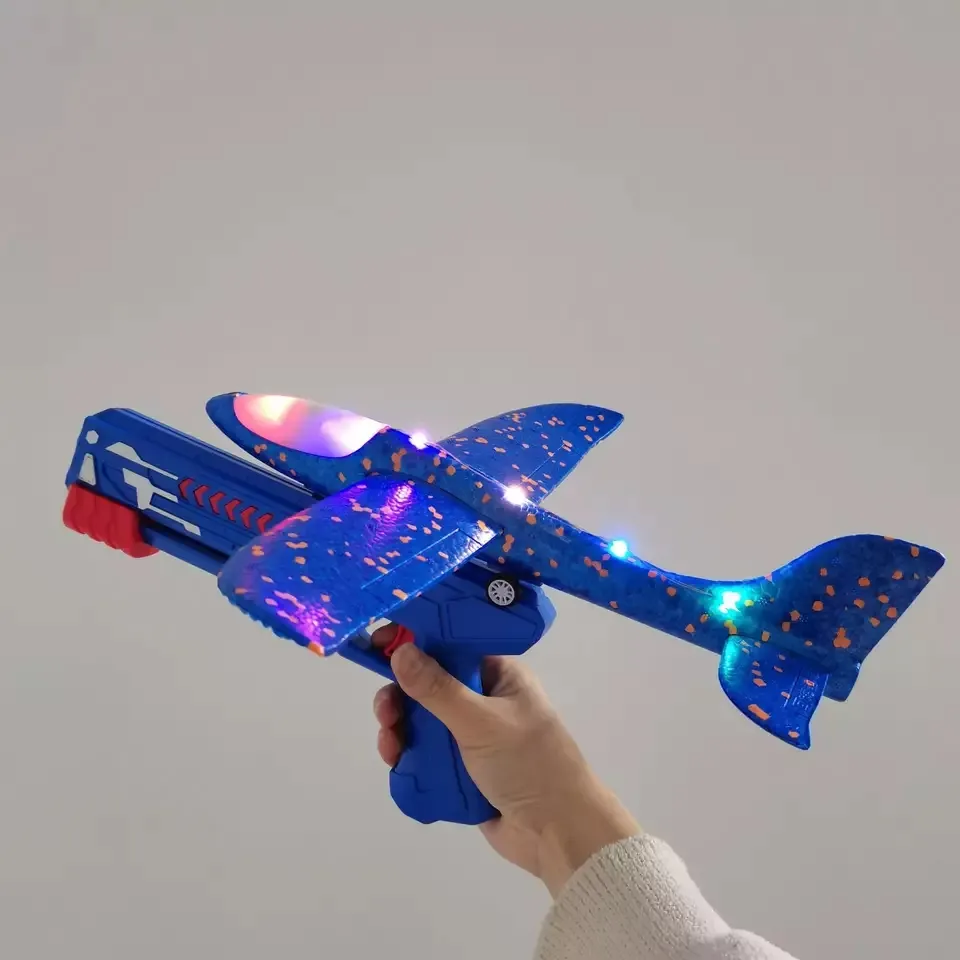 Outdoor-Spiel Kinder Schaum Handwurf 3 Farbe segel flugzeug Flug Fliegendes Flugzeug Schießen Pistole Katapult Flugzeug Pistole Launcher Spielzeug mit Licht