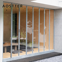 Puerta Plegable de Aluminio con Aspecto de Madera AOSTTER, con Doble Acristalamiento Low-E IGU y Herrajes para Uso Tradicional en Propiedades