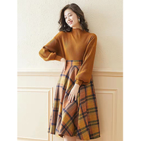 Vendeurs de vêtements printemps et automne demi col roulé manches bouffantes haut tricoté et jupe trapèze à carreaux ensemble deux pièces vêtements pour femmes