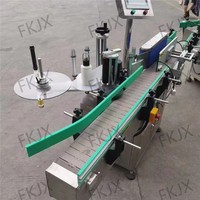 Machine d'étiquetage de bouteilles rondes de haute précision FKJX avec écran tactile PLC pour les contenants de liquides chimiques quotidiens