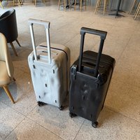 Valise rigide de luxe unisexe classique en PC, design concave-convexe, roues multidirectionnelles universelles, grande capacité, silencieuse, exportée du Royaume-Uni