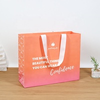 Sacs de shopping en papier de marque haut de gamme avec impression de logo personnalisée élégante pour clinique de laser cutané