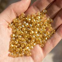 Großhandel Leichte Colorado Topas Kristall Bicone Strass 4mm Facettierte Aufnäh-Glasperlen für Kleidung Stickerei Schmuck DIY