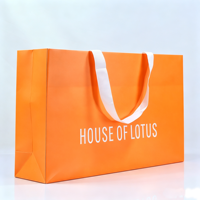 Sacs d'emballage en papier orange personnalisés pour vêtements, de luxe, pour boutiques de vêtements, pour la vente au détail, respectueux de l'environnement