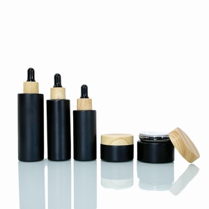 Tarros de crema facial negros mate de 5/10/15/20/30/50 g en stock al por mayor, tarros de vidrio de 1, 2 y 4 onzas con tapa de plástico color bambú y tapa de rosca. - Product Image 6