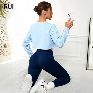 RUIQUWIN Vente en gros Ensemble de yoga 3 pièces sans couture pour femme, couleur unie, haut à manches longues, soutien-gorge de sport, leggings taille haute, ensemble de fitness - Product Image 1