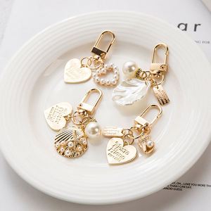 Elegant Letter Label Women Girls Pearls <b>Key</b> <b>Chain</b> Handbag Hanging Pendant Keyring Heart Shell Pendant Keychain - Product Image 1