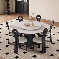 Table à manger en pierre minimaliste moderne italienne en quartzite noir vintage avec plateau central rotatif pour restaurant