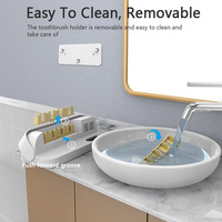 Désinfectant pour brosse à dents familiale rechargeable par USB avec fonction de désinfection sèche et UV par ventilateur à quatre fentes pour brosses à dents