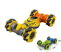 Voiture télécommandée HOSHI 1611 2.4G 4WD RC Stunt Car 1/24 avec contrôle gestuel par montre, moteur sans noyau, rotation à 360°, 2 batteries
