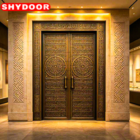 Porte d'entrée principale de villa de luxe, style mosquée arabe, en cuivre antique sculpté, double porte de sécurité islamique