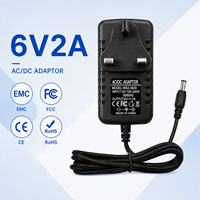 Adaptateur secteur AC/DC 6V 2A avec protection contre les courts-circuits, prise UK, 5,5x2,5 mm, 12W, chargeur mural pour éclairage LED et éclairage de placard (ODM/OEM)