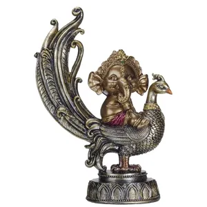 Resin Hindu elephant god Ganesha statue of the Lord of success in peacock. Religious decoration