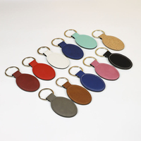 Porte-clés ovales vierges en similicuir laserable à fort contraste, personnalisables en gros avec logo pour l'image de marque des entreprises