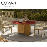 Table de salle à manger ronde en teck de luxe moderne pour l'extérieur avec finition résistante aux intempéries pour hôtel, patio, restaurant, jardin