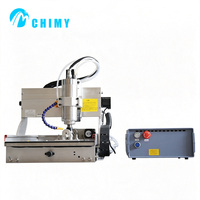 Mini machine de gravure CNC 4 axes 3040 avec broche à refroidissement par eau pour la sculpture 3D ronde et plate destinée à la fabrication artisanale