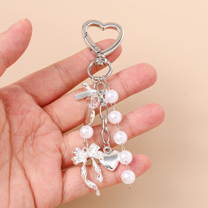 Porte-clés tendance 2026 avec pendentif nœud, strass scintillants, cœur en perle, alliage de zinc, mousqueton étanche, breloque pour sac de téléphone portable - Product Image 4
