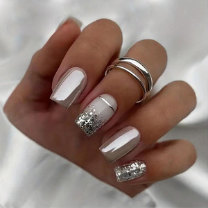 <span class=keywords><strong>Uñas</strong></span> postizas acrílicas ABS <span class=keywords><strong>de</strong></span> cobertura completa, estilo ataúd, medianas, blancas con purpurina plateada, efecto brillante, a presión. - Product Image 1