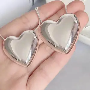 Hot selling stainless steel lovely water sound bell 3D heart shape bell for woman jewelry accessories